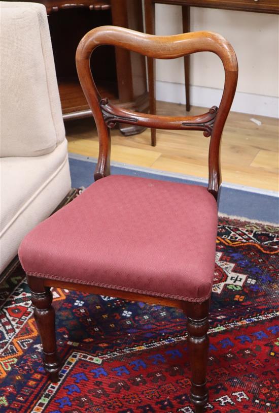 A set of five Victorian mahogany buckle back dining chairs with stuffover seats and a similar chair